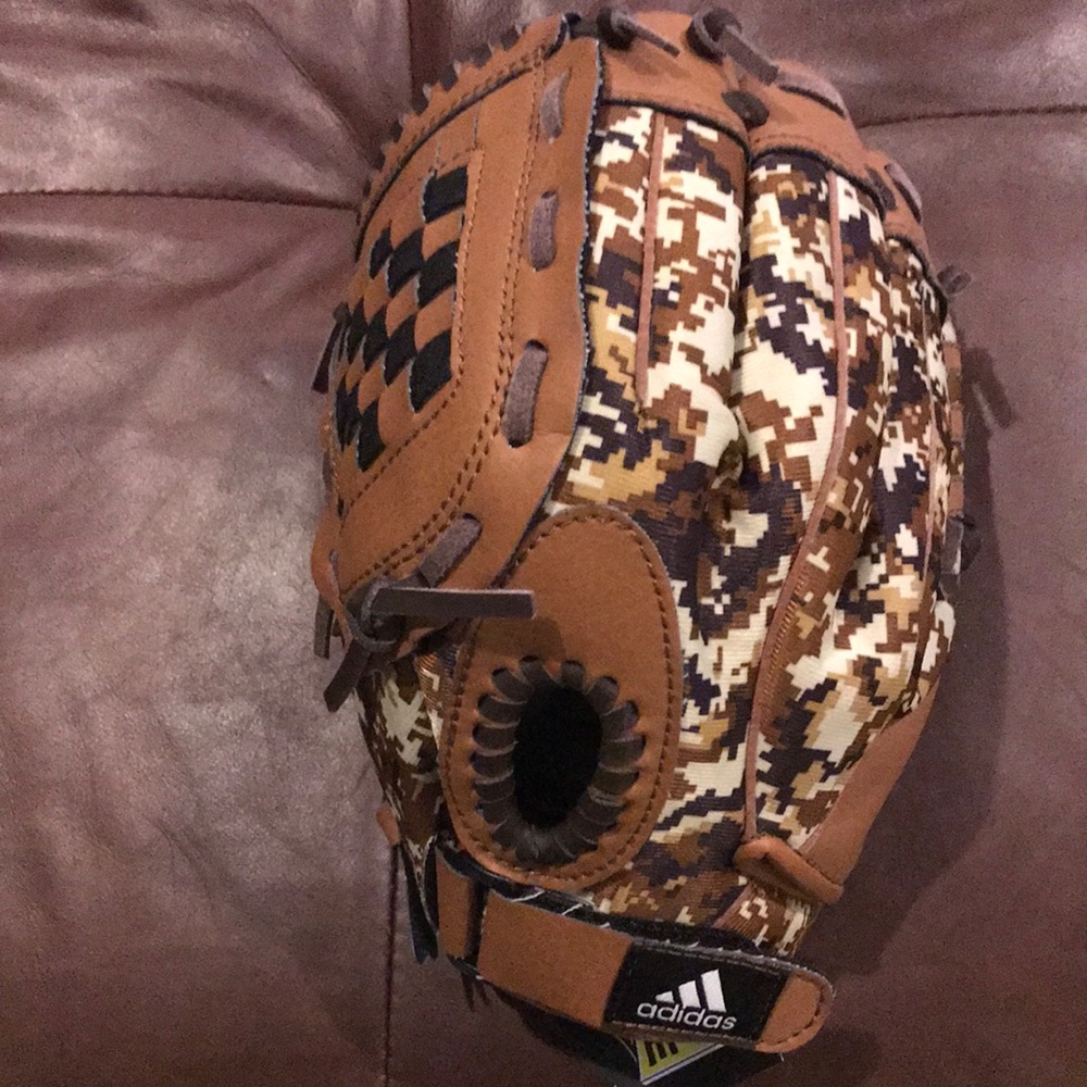 Youth adidas baseball glove for left handed child.